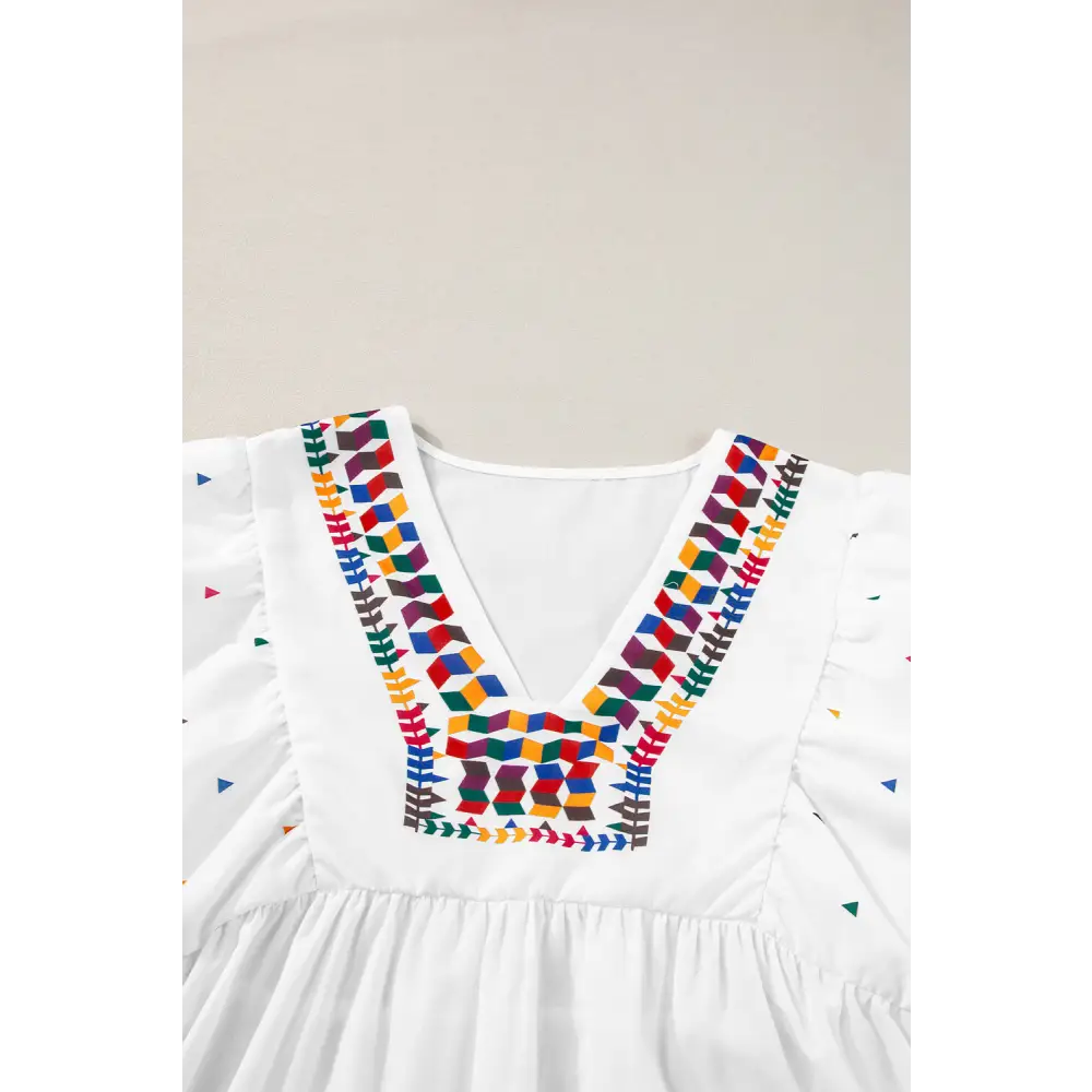 Chic White Babydoll Blouse with Colorful Geometric Print and V-Neck - Perfect for Casual or Dressy Occasions - Blouses