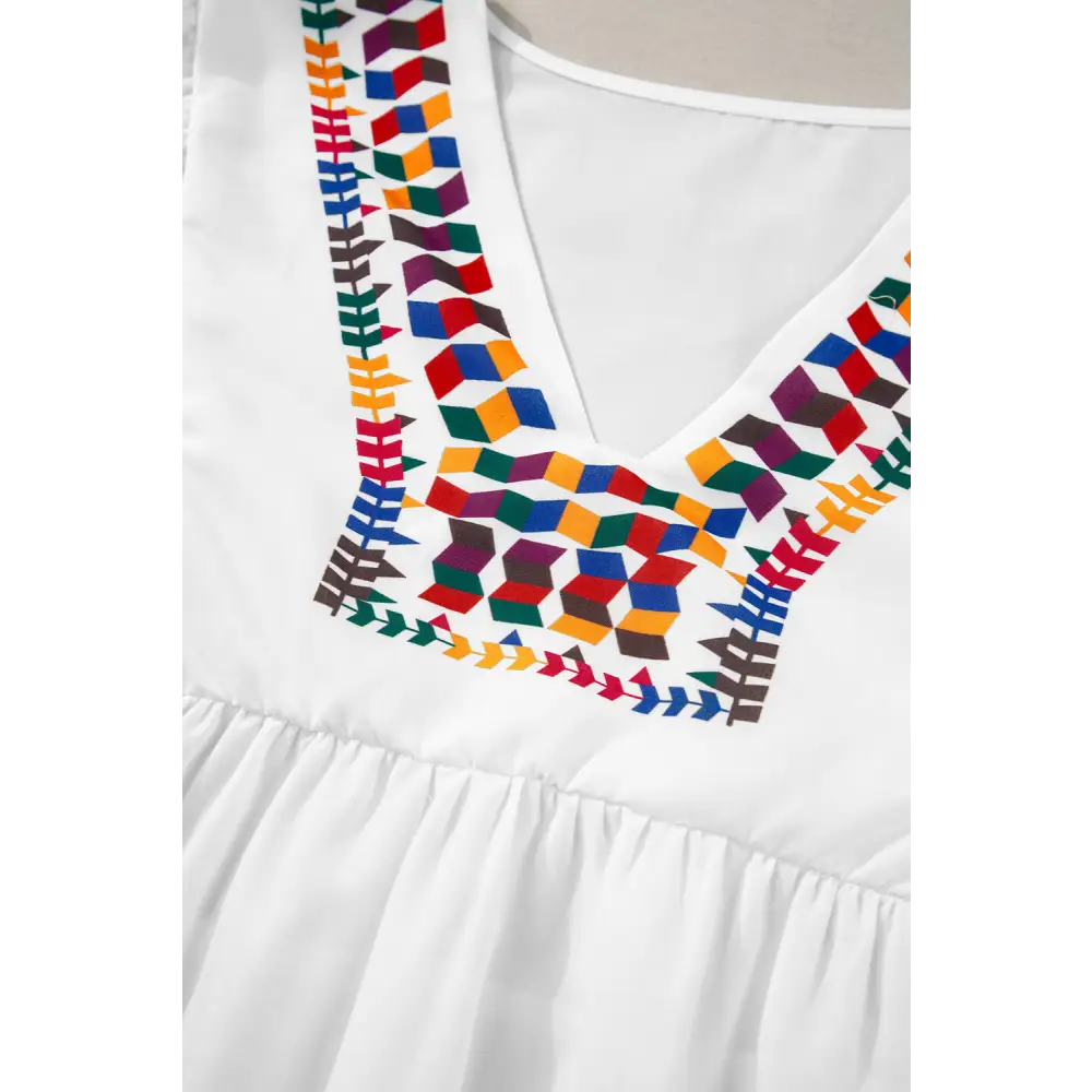 Chic White Babydoll Blouse with Colorful Geometric Print and V-Neck - Perfect for Casual or Dressy Occasions - Blouses