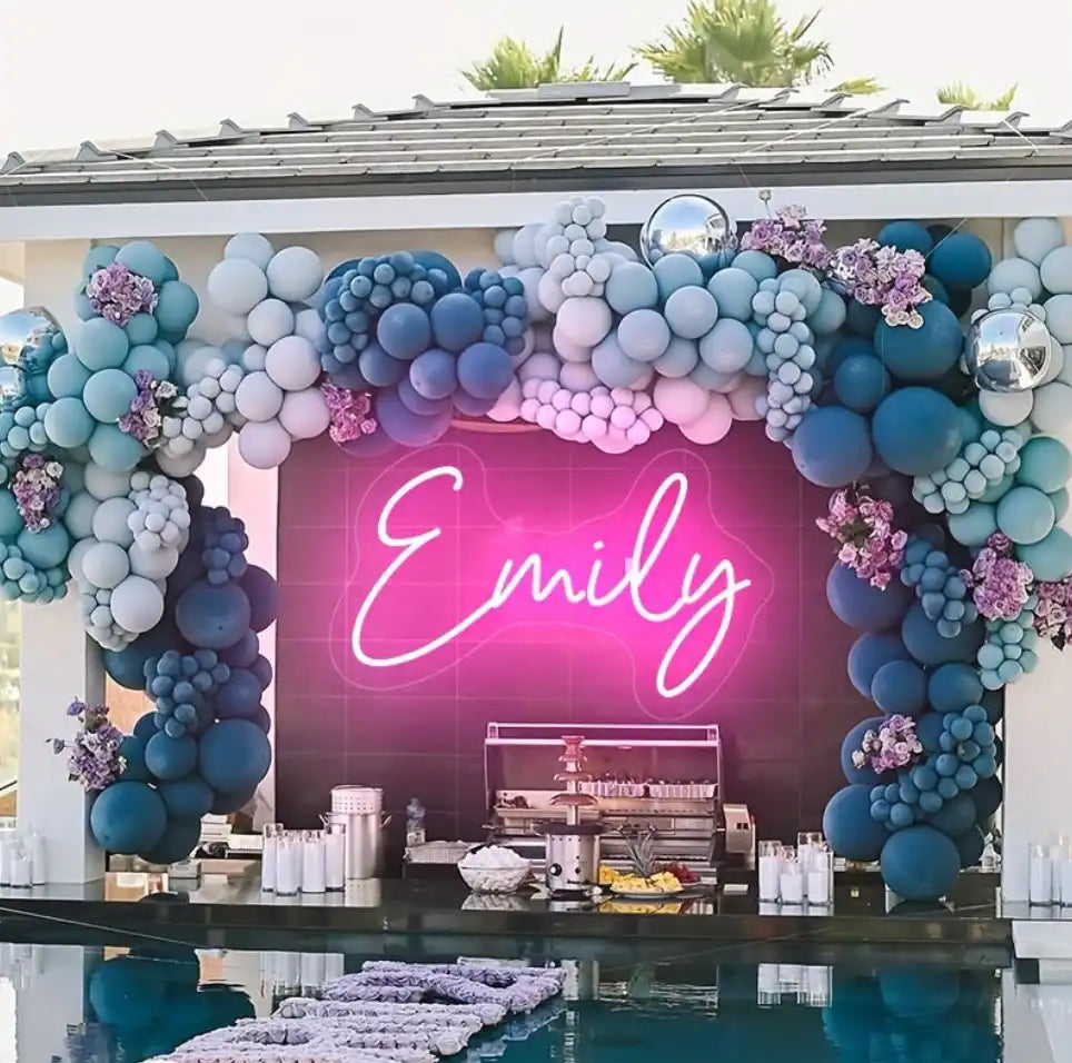 Balloon arch with neon name sign.